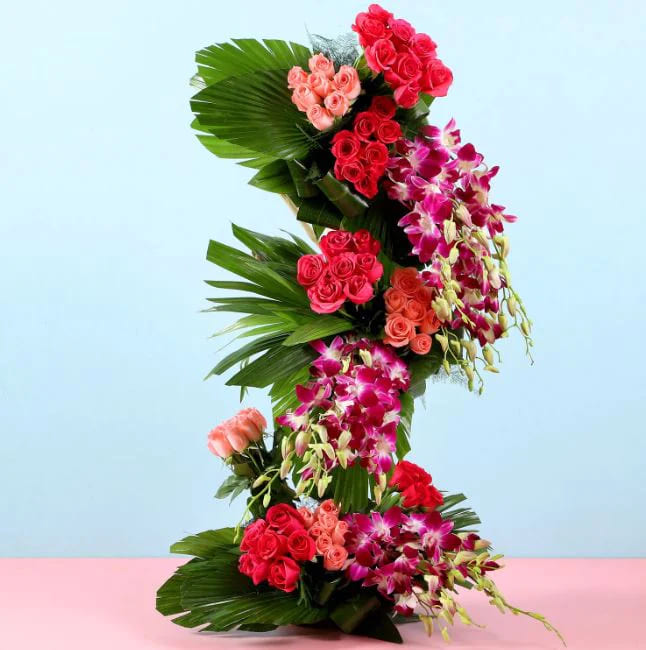 Majestic tall floral arrangement featuring exotic lilies, gladioli, and long-stemmed roses for online delivery in Hyderabad